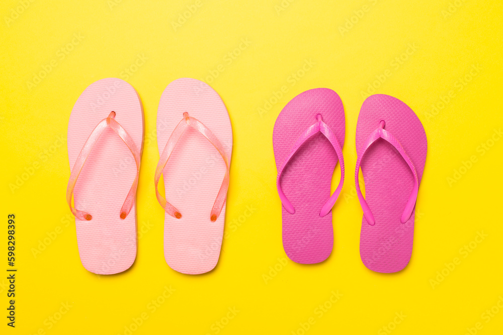 Bright flip flops on color background, top view Bright flip flops on color background, top view