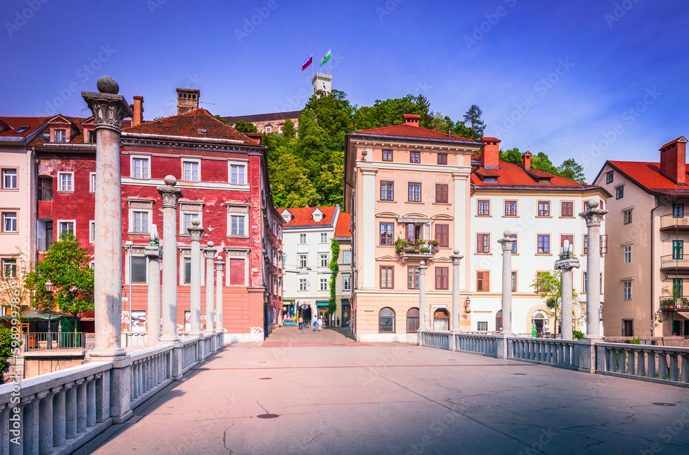 Ljublijana, Slovenia. Cobblers' Bridge, picturesque pedestrian bridge and view of the Castle.