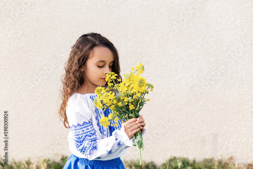 A little girl in Ukrainian national dress. Ukraine. Stop wor photo