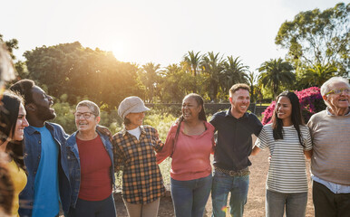 Group of multigenerational people hugging each others - Support, multiracial and diversity concept - Main focus on senior african woman face