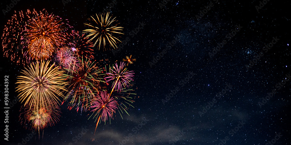 Fototapeta premium Fireworks with blur milky way background