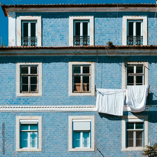Portugal, Lisbon, Typical Portuguese Pombaline building with laundry hanging to dry photo