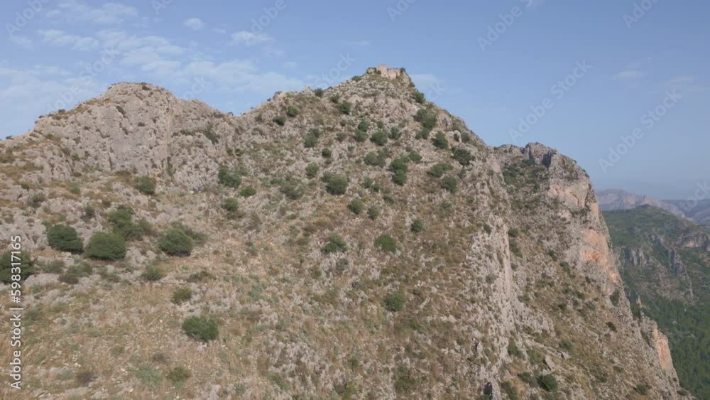 Mountain landscape and Garx castle in Tarbena Valley. Alicante Mountain landscape and Garx castle in Tarbena Valley. Alicante
