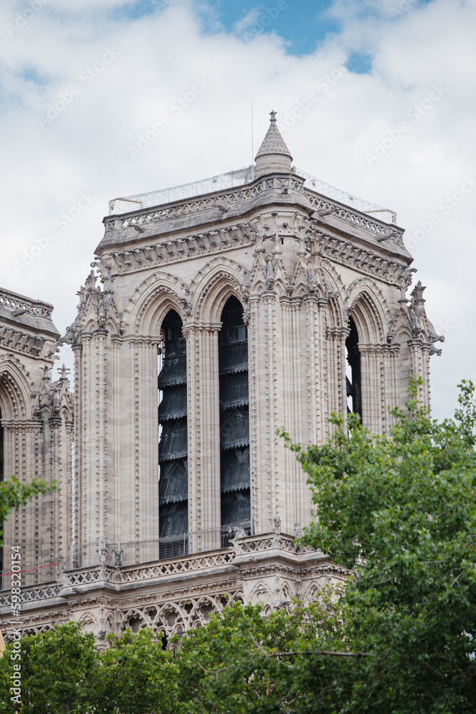 Obraz premium Paris, France - May 31, 2022: The facade and towers of Notre Dame are a symbol of renewal, reconstruction and resilience - reopening soon after restoration