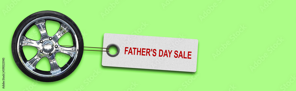 Obraz premium Father's Day sale background. Car wheel and label on a bright green background.Business. Trade. Holidays.