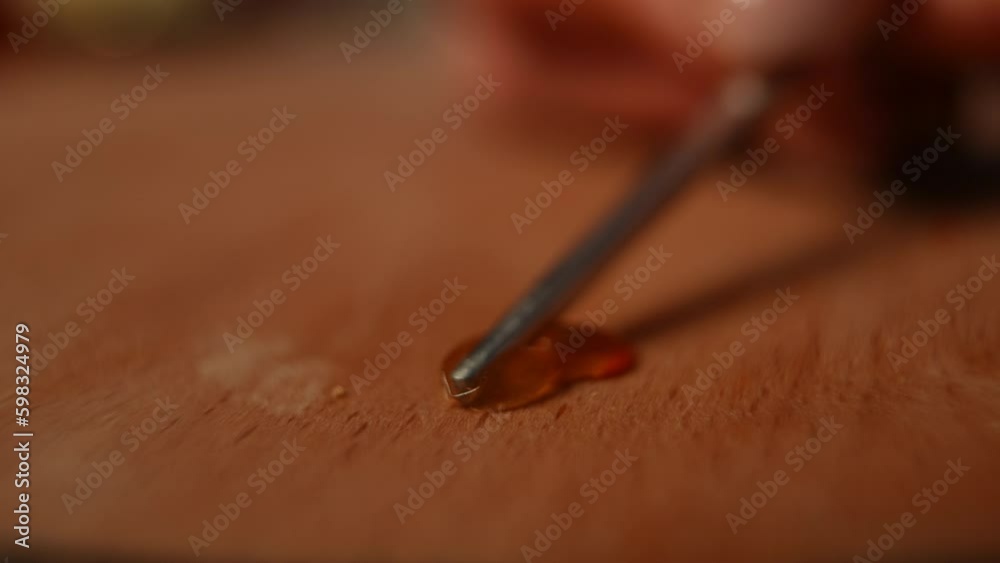 Close-up smashing red caviar in slow motion on wooden table. extreme closeup delicious delicatessen premium food on cutting board in kitchen Close-up smashing red caviar in slow motion on wooden table. extreme closeup delicious delicatessen premium food on cutting board in kitchen