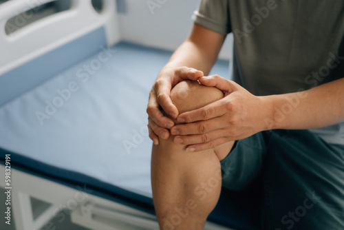 Close up man suffering from Joint pain, knee pain.