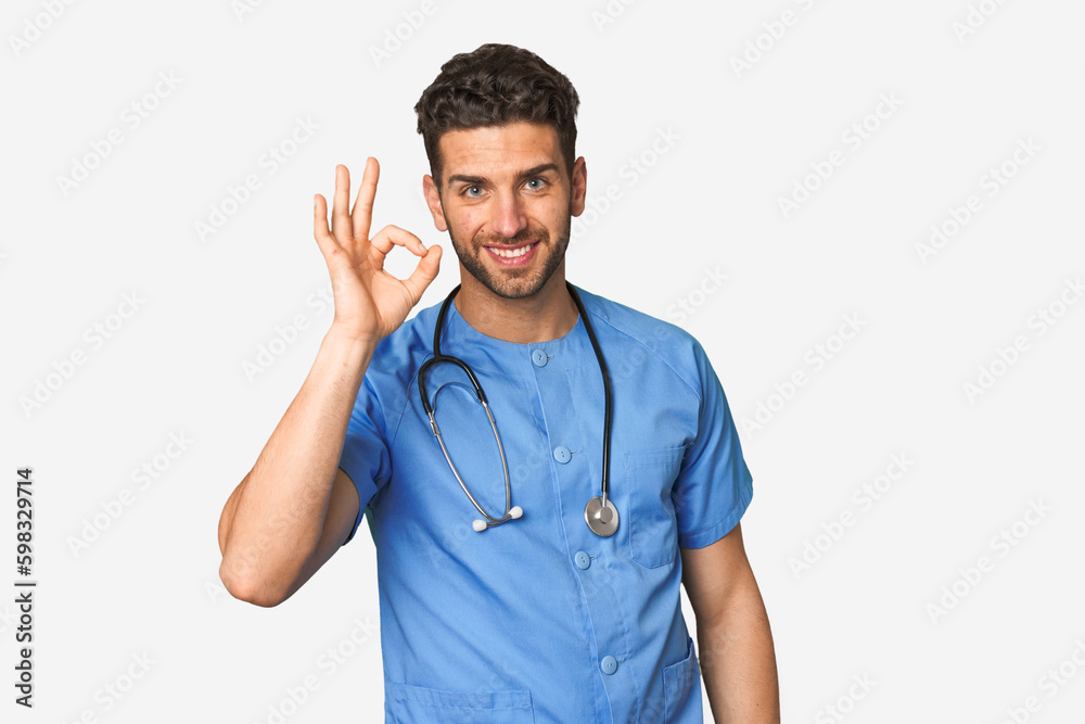 Young nurse man cheerful and confident showing ok gesture. Young nurse man cheerful and confident showing ok gesture.