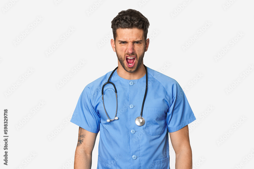 Young nurse man screaming very angry and aggressive. Young nurse man screaming very angry and aggressive.
