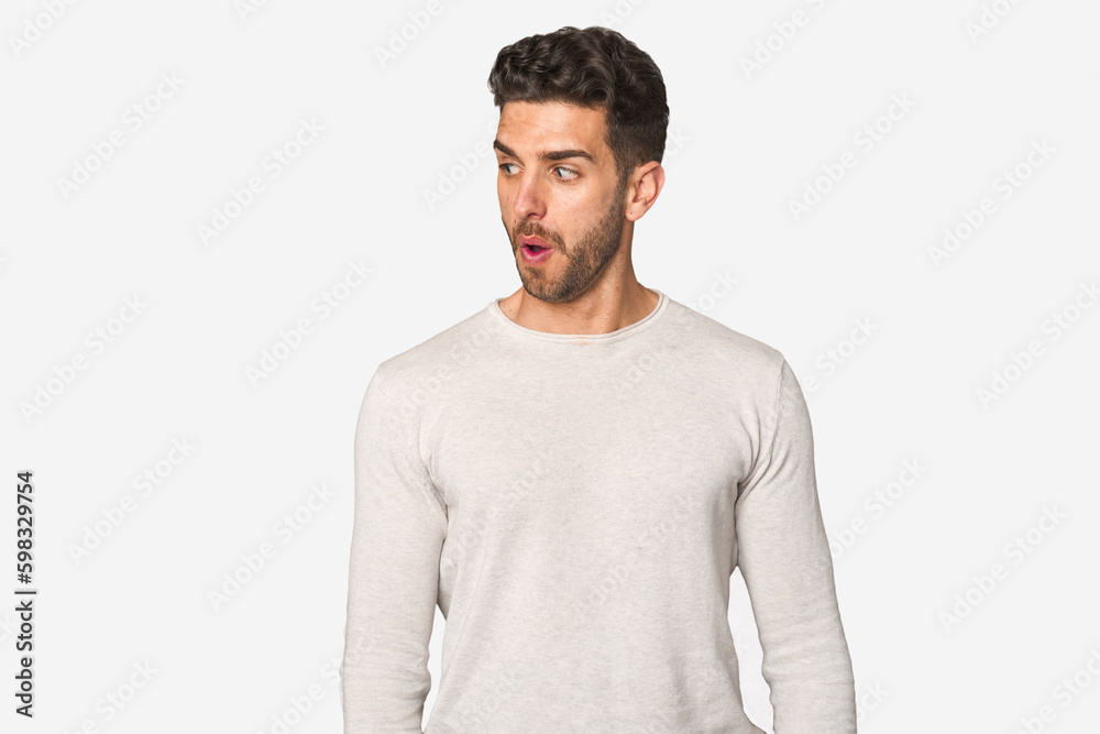 Young handsome man isolated being shocked because of something she has seen. Young handsome man isolated being shocked because of something she has seen.