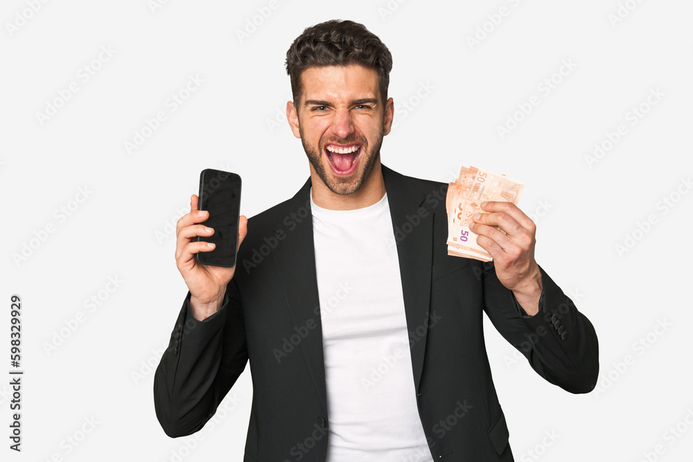 Young businessman seizing his phone and euros, symbolizing lucrative online earnings and financial achievement. Young businessman seizing his phone and euros, symbolizing lucrative online earnings and financial achievement.