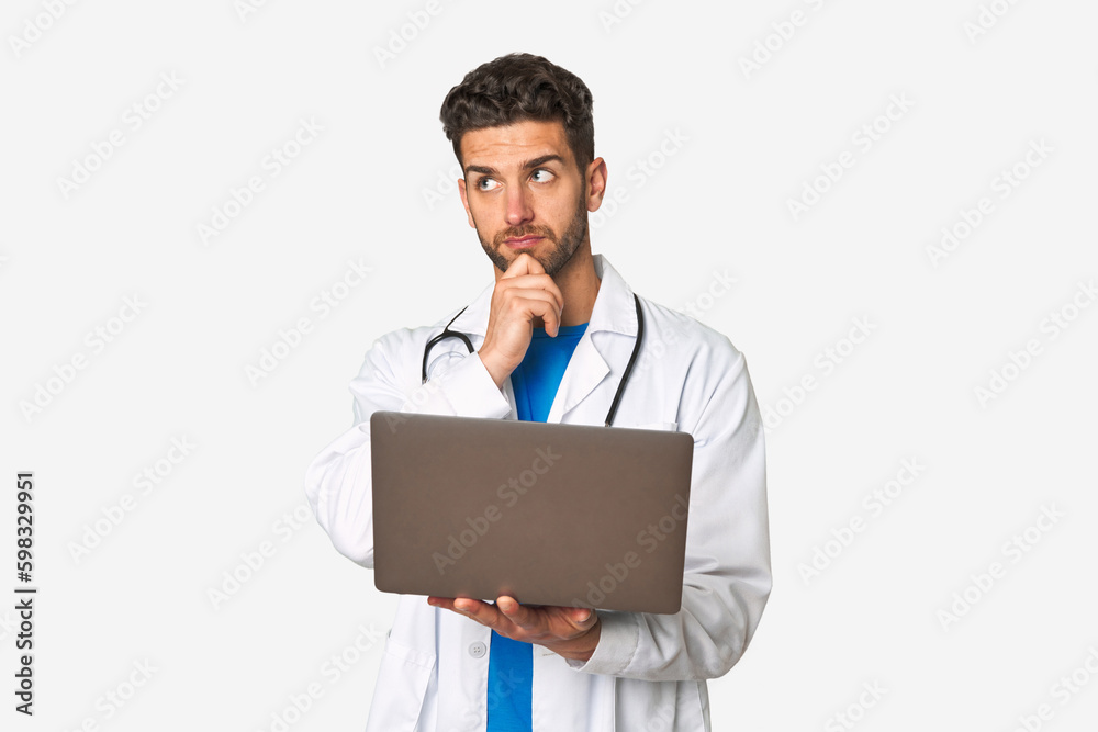 Medical professional working on laptop. Medical professional working on laptop.