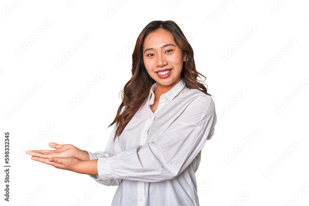 A young chinese woman holding a copy space on a palm. A young chinese woman holding a copy space on a palm.