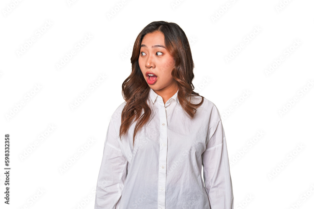 A young chinese woman being shocked because of something she has seen. A young chinese woman being shocked because of something she has seen.