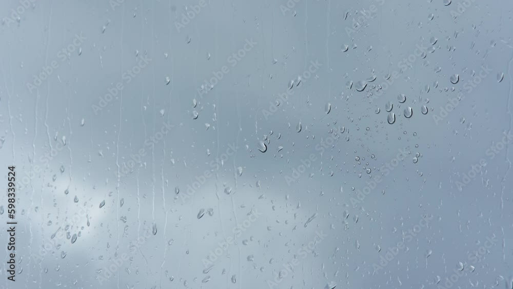 Raindrops on the window. Large rain drops strike a window pane during a summer shower. Generative AI Raindrops on the window. Large rain drops strike a window pane during a summer shower. Generative AI
