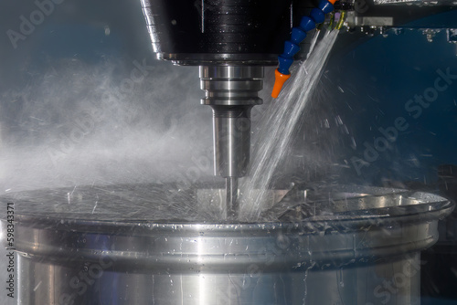 Photos The  CNC milling machine cutting the magnesium alloy wheel part with ball end mill tool