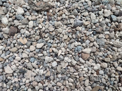 Gravel is small stones formed by the natural process of rock erosion. Gravel can be found in rivers, beaches, or even on roads as a hardening agent. Smooth and colorful pebbles.