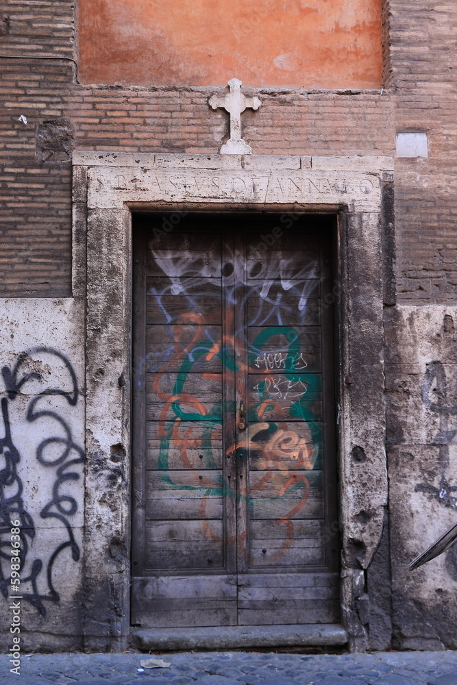 custom made wallpaper toronto digitalBuilding Facade Detail with Aged Wooden Door, Graffiti and Cross in Rome, Italy