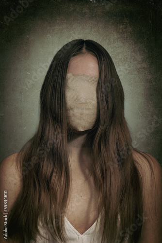 woman suffering from mental disorder , conceptual image of girl hiding  her face ,depression or low self esteem .