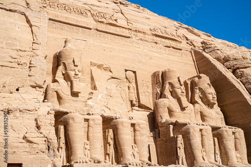 Statues of Ramses II at the entrance to the Abu Simbel temple in Egypt photo