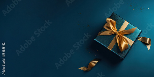 Luxurious Gold Present Box with Ribbon on Blue Background