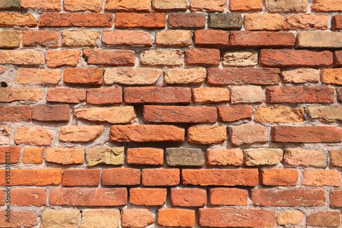 Ancient city wall made with old red bricks