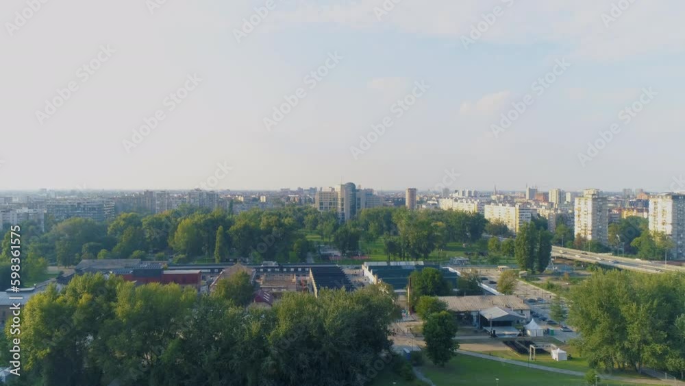 Drone shot of a town gentrified industrial area at dusk. Aerial drone shot of a densely populated area low and high rise buildings. Trees and houses. Drone shot of a town gentrified industrial area at dusk. Aerial drone shot of a densely populated area low and high rise buildings. Trees and houses.