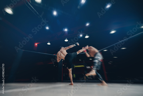 MMA Boxers fighters in fights without rules in ring cargo octagon hit kick, dark background spot light