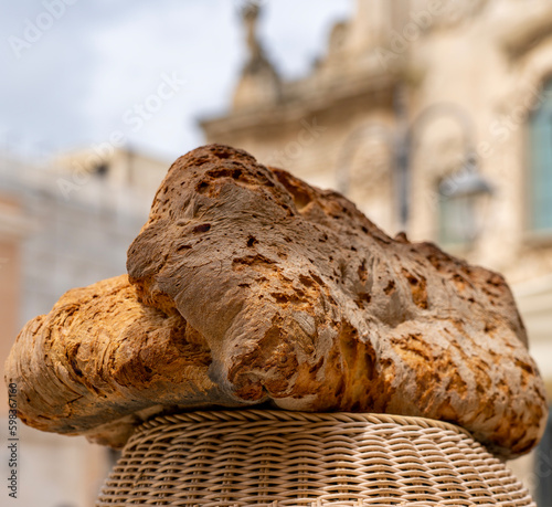 The traditional Pane di Altamura is a type of Italian naturally leavened bread made from durum wheat semola from the Altamura area (Bari), in the Apulia region, south of Italy photo