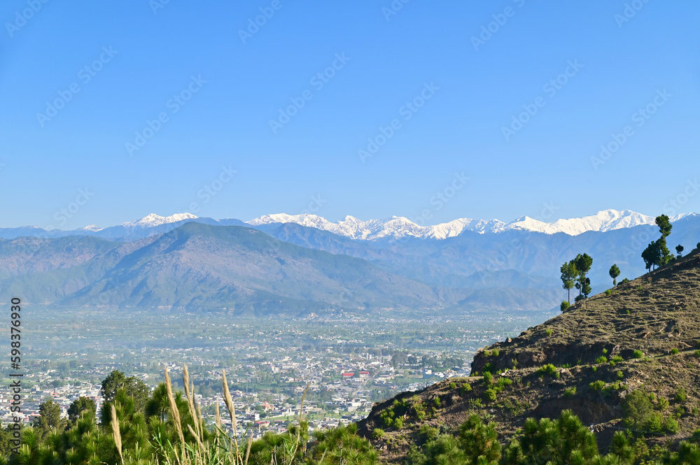 Aerial View of Mansehra City with Mountain Range in Pakistan