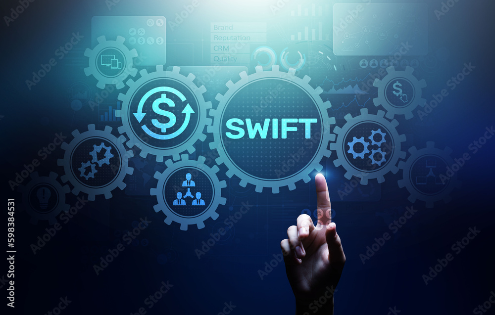SWIFT international payment system financial technology banking and money transfer concept on virtual screen. SWIFT international payment system financial technology banking and money transfer concept on virtual screen.