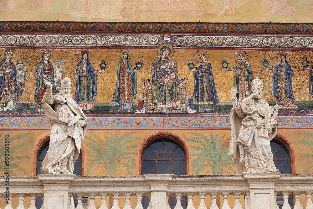 Fototapeta premium Santa Maria in Trastevere Church Exterior Close Up with Mosaic, Statues and Balustrade in Rome, Italy
