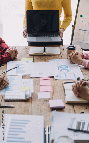 Brainstorming Collaboration and successful partnership analysis by Young business Asian people working in an office workspace