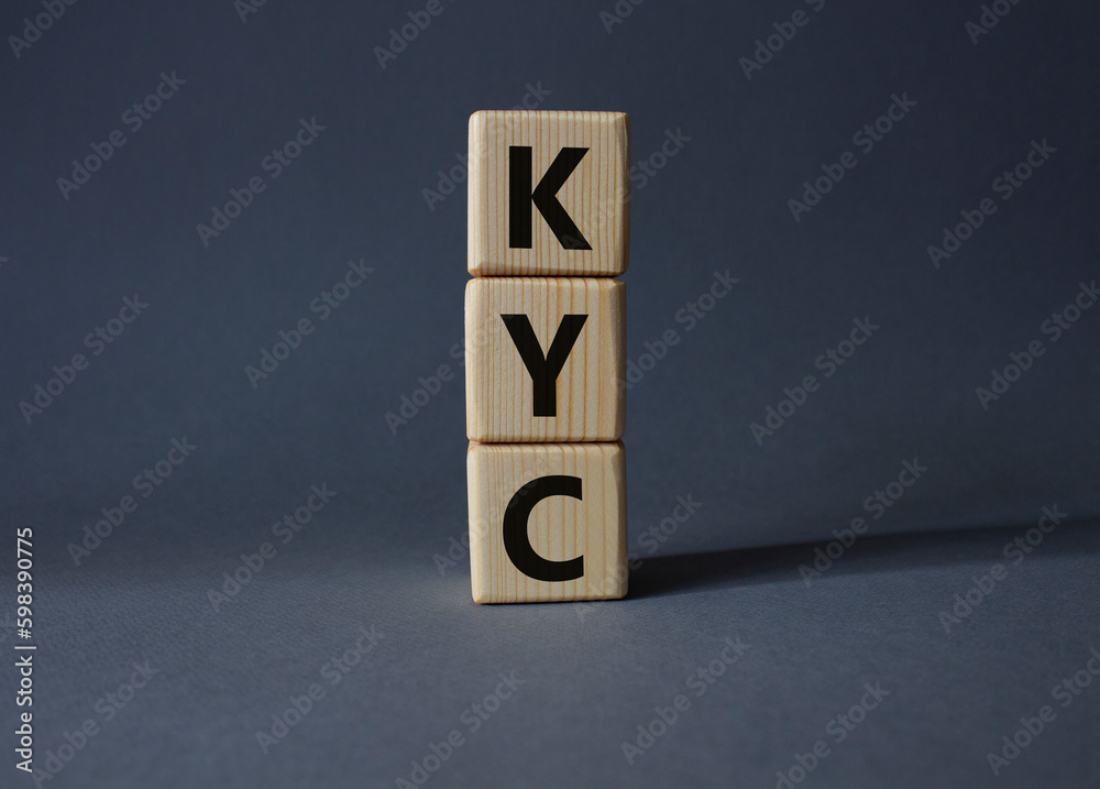 KYC - Know Your Customer. Wooden cubes with word KYC. Beautiful grey background. Business and Know Your Customer concept. Copy space. KYC - Know Your Customer. Wooden cubes with word KYC. Beautiful grey background. Business and Know Your Customer concept. Copy space.
