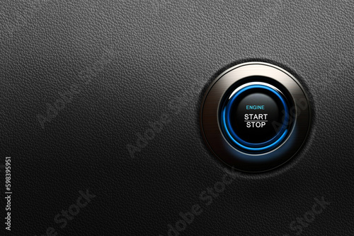 Engine start button with blue glowing ring on a modern car photo