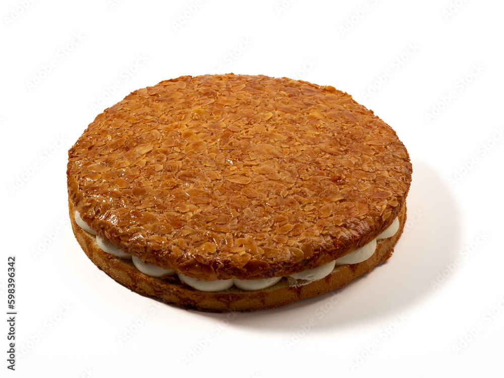 Bee sting cake, light cake with cream filling, with crispy almonds. Cake with almonds on a white background. Bee sting cake, light cake with cream filling, with crispy almonds. Cake with almonds on a white background.