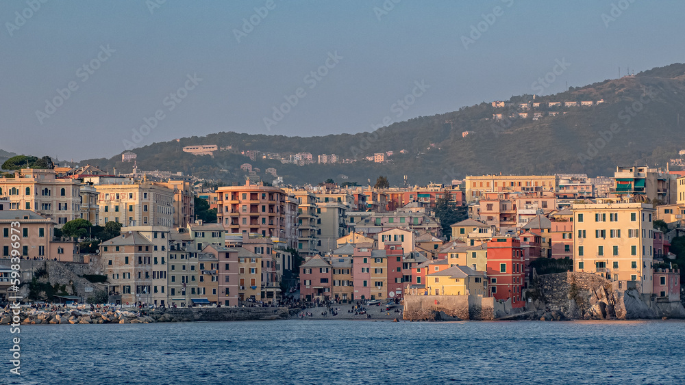 Boccadasse, small sea district of Genoa, seen from the sea during the twilight. Liguria, Italy.