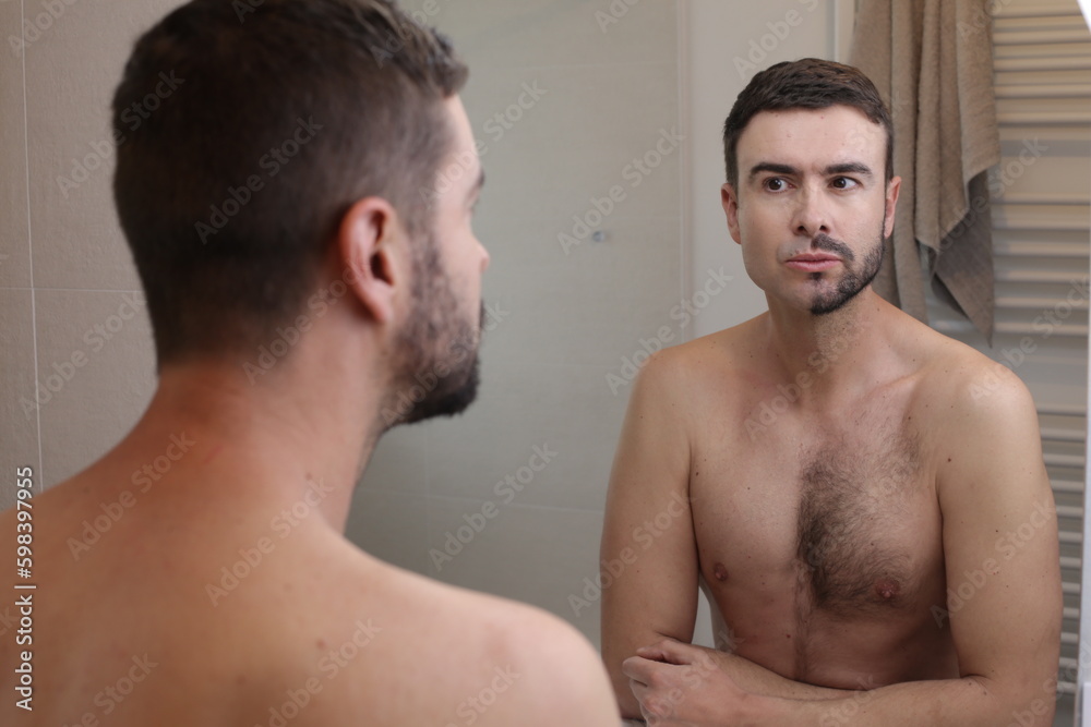Shirtless man with half beard and half hairy chest Shirtless man with half beard and half hairy chest