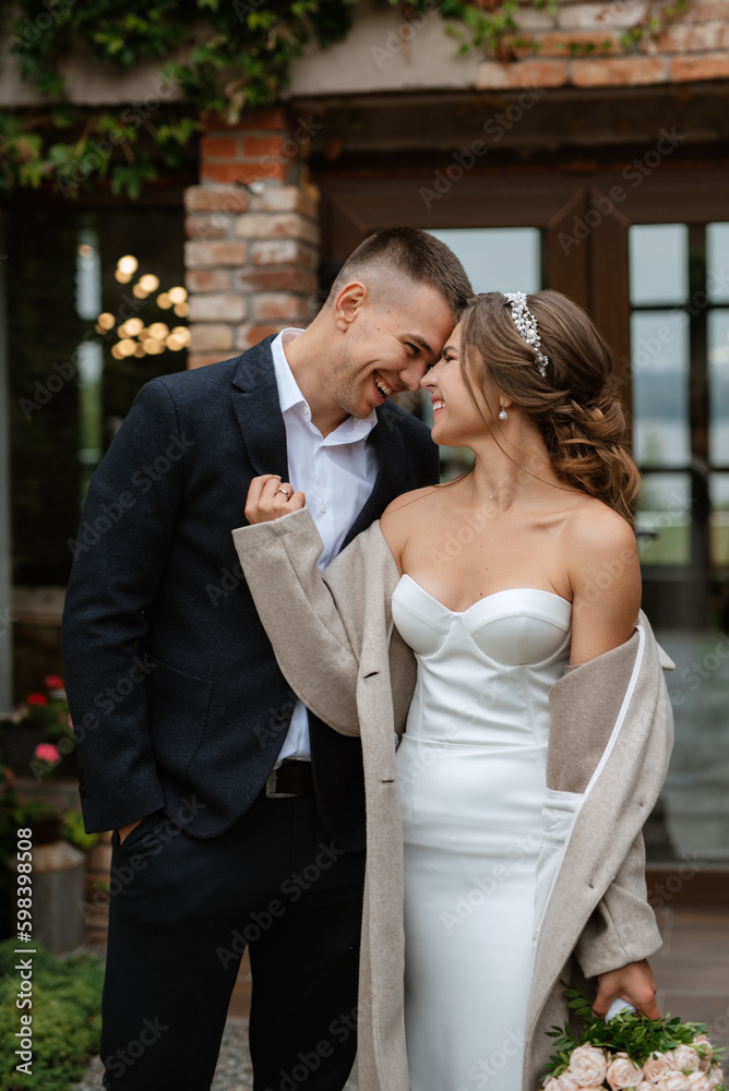 portrait of a young couple of bride and groom on their wedding day portrait of a young couple of bride and groom on their wedding day