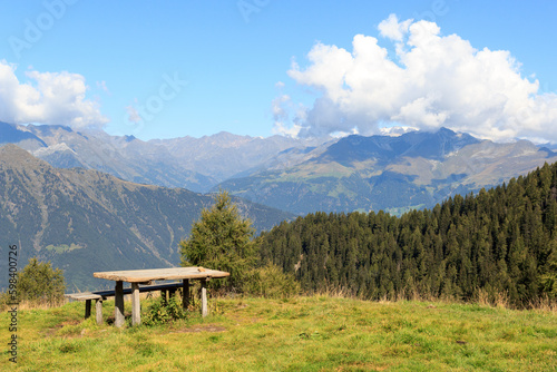Mountain panorama view and bench seen from mountain Hirzer in Saltaus, South Tyrol, Italy
