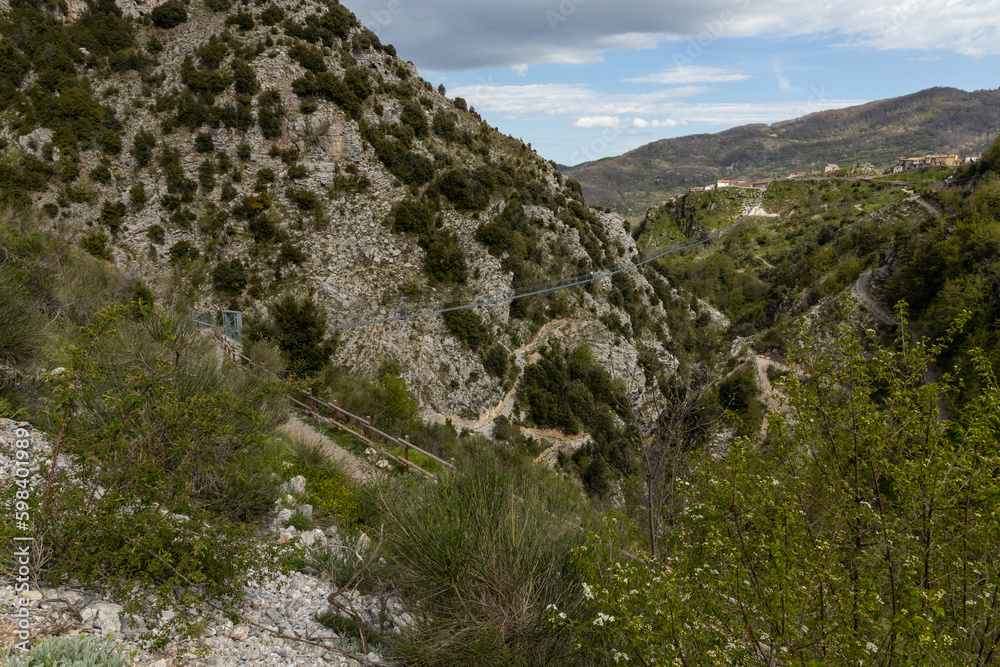 Longest Tibetan bridge in the world located in Castelsaraceno in Italy. The steel bridge spans 580m on a walkway with separate platforms overlooking a breathtaking panorama.