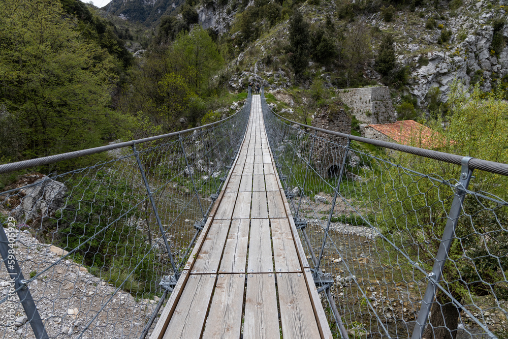 Obraz premium Longest Tibetan bridge in the world located in Castelsaraceno in Italy. The steel bridge spans 580m on a walkway with separate platforms overlooking a breathtaking panorama.