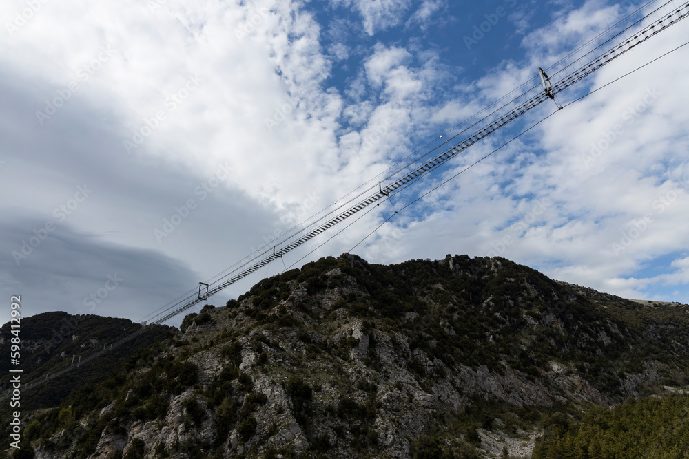 Longest Tibetan bridge in the world located in Castelsaraceno in Italy. The steel bridge spans 580m on a walkway with separate platforms overlooking a breathtaking panorama.