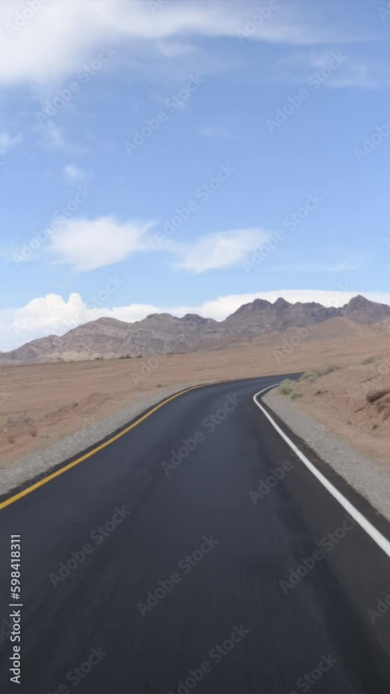 Immersive first-person view of winding desert road. Adventure, scenic route, climate change concept. Immersive first-person view of winding desert road. Adventure, scenic route, climate change concept.