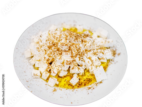 Fresh feta cheese full of olive oil and oregano white isolated