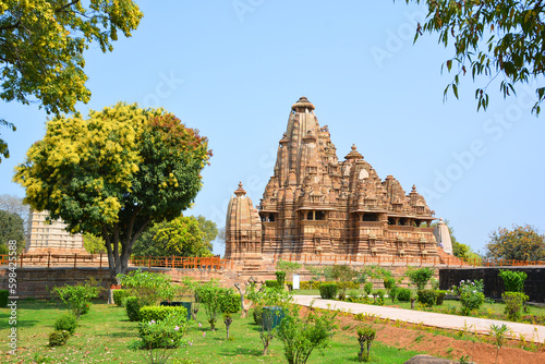 Khajuraho Group of Monuments are a group of Hindu and Jain temples famous for their nagara-style architectural symbolism and a few erotic sculptures photo