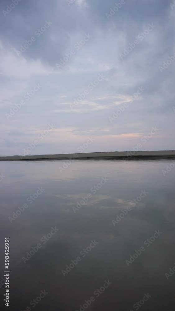 vertical beautiful beach portrait video view in the afternoon, you can see the small waves and the beach vertical beautiful beach portrait video view in the afternoon, you can see the small waves and the beach