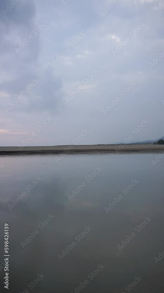 vertical beautiful beach portrait video view in the afternoon, you can see the small waves and the beach vertical beautiful beach portrait video view in the afternoon, you can see the small waves and the beach