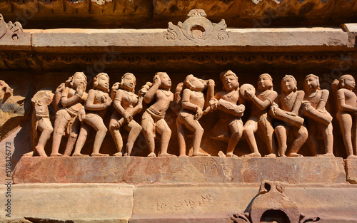 Khajuraho Group of Monuments are a group of Hindu and Jain temples famous for their nagara-style architectural symbolism and a few erotic sculptures photo