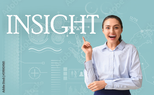 Happy businesswoman pointing at word INSIGHT on color background photo